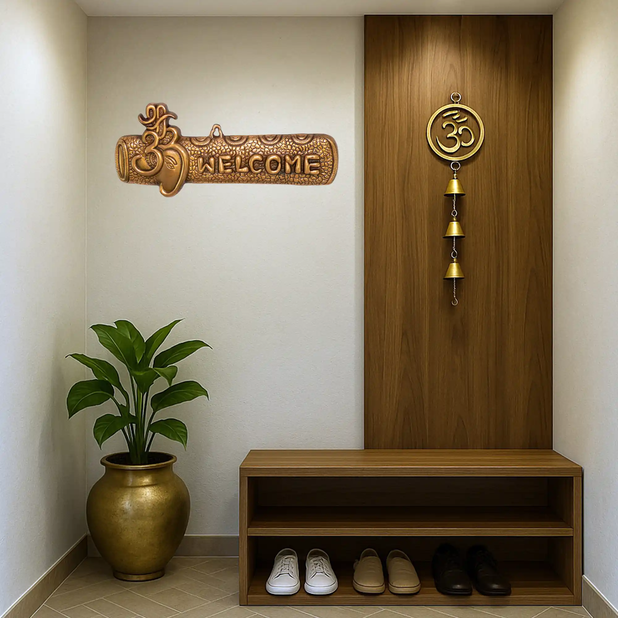Ganesha metal welcome plate installed in modern foyer entrance wall
